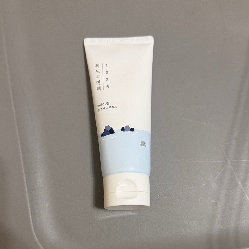 White and Light Blue Skincare Tube